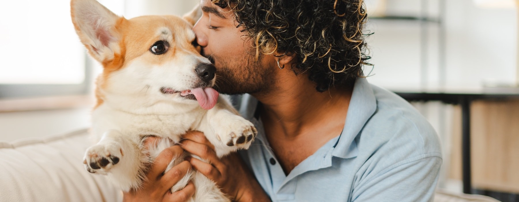a man holding a dog